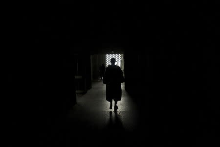 A lawyer walks into the hall of the court of Abidjan July 2, 2015. Picture taken July 2, 2015. REUTERS/Luc Gnago