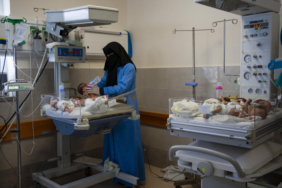 A nurse prepares premature babies for transport to Egypt after they were evacuated from Shifa Hospital in Gaza City to a hospital in Rafah, Gaza Strip, Monday, Nov. 20, 2023. (AP Photo/Fatima Shbair)