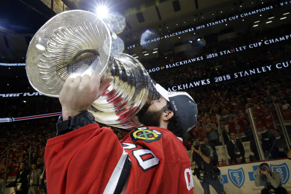 FILE - In this June 15, 2015, file photo, Chicago Blackhawks' goalie Corey Crawford kisses the Stanley Cup Trophy after defeating the Tampa Bay Lightning in Game 6 of the NHL hockey Stanley Cup Final series in Chicago. The past few weeks have seen several recent Stanley Cup winners get rid of members of their championship core. The Blackhawks moved on from Corey Crawford, the Washington Capitals did the same with Braden Holtby, the Pittsburgh Penguins traded fellow goalie Matt Murray and forward Patric Hornqvist and the St. Louis Blues signing Torey Krug means captain Alex Pietrangelo will sign elsewhere. (AP Photo/Nam Y. Huh, File)