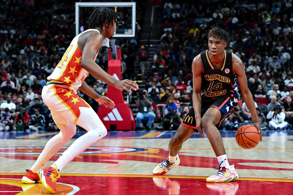 Ja'Kobe Walter (14) puts a move on a defender during the McDonald's All American Game. (Maria Lysaker-USA TODAY Sports)