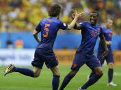 Daley Blind (L) of the Netherlands celebrates scoring their second goal with Georginio Wijnaldum during their 2014 World Cup third-place playoff against Brazil at the Brasilia national stadium in Brasilia July 12, 2014. REUTERS/Dominic Ebenbichler (BRAZIL - Tags: SOCCER SPORT WORLD CUP)