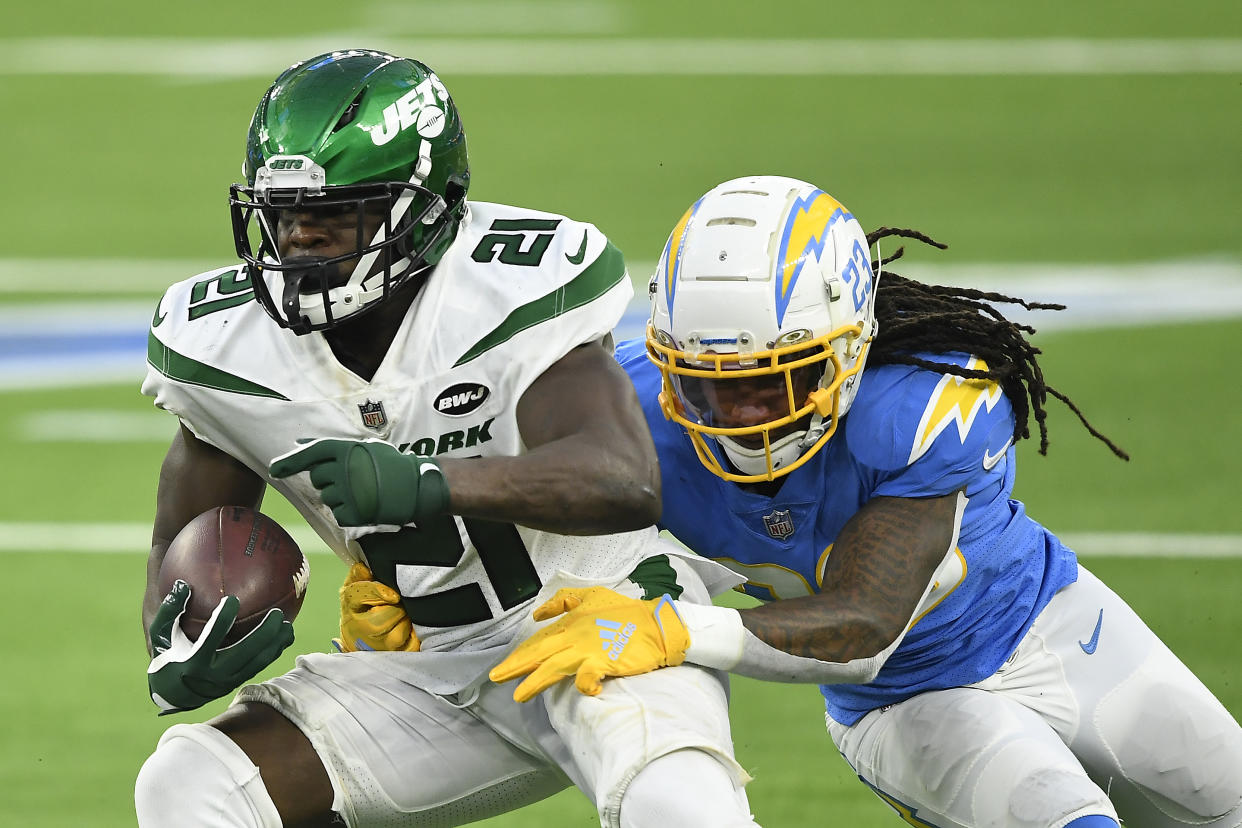 INGLEWOOD, CALIFORNIA - NOVEMBER 22: Frank Gore #21 of the New York Jets is tackled by Rayshawn Jenkins #23 of the Los Angeles Chargers during the second half at SoFi Stadium on November 22, 2020 in Inglewood, California. (Photo by Kevork Djansezian/Getty Images)