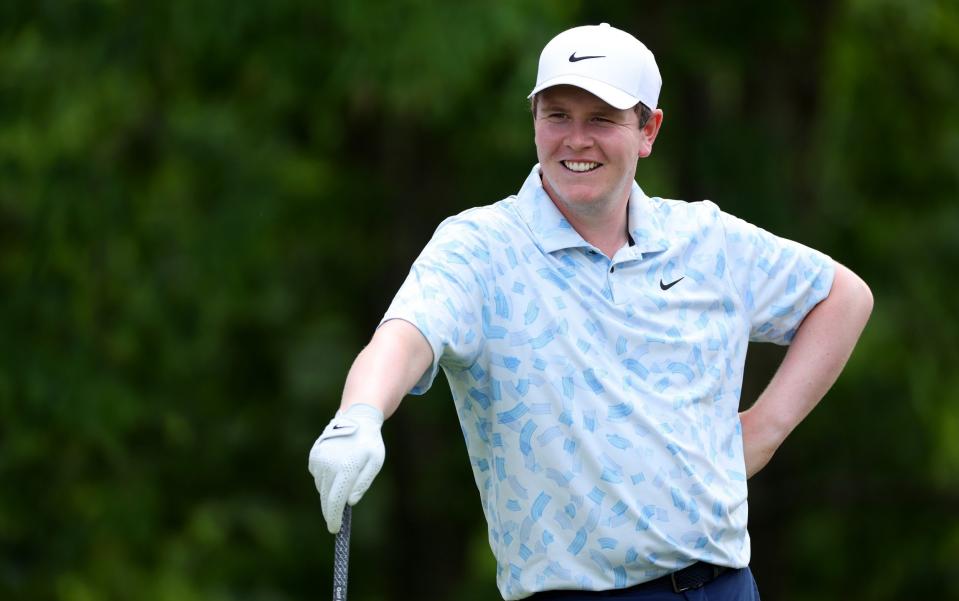 Robert MacIntyre smiles on the 18th tee