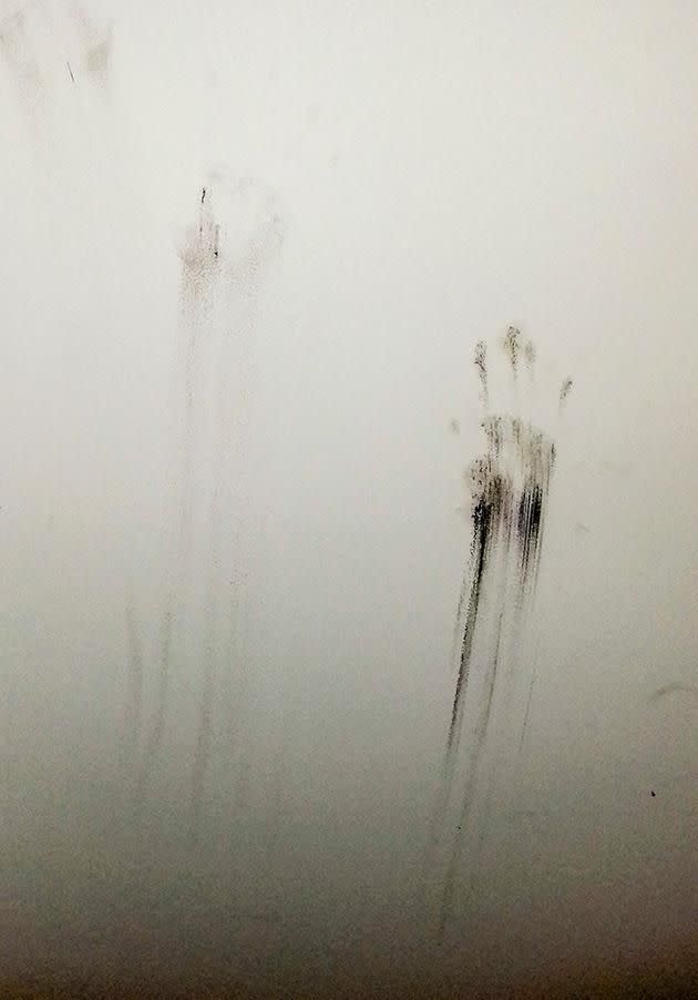 Joanne says she found these black handprints in her daughter's bedroom. Photo: Caters News