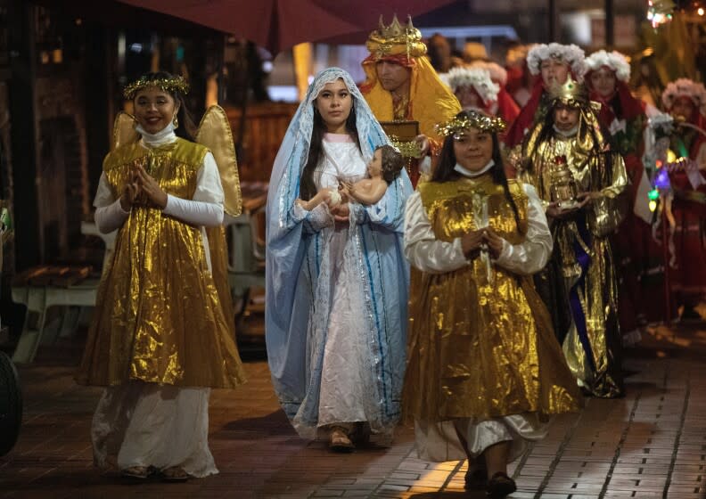 The Olvera Street Merchants Assn. Foundation's Dia de los Reyes procession at Olvera Street Thursday, January 6, 2022. The procession ended with games, prizes, champurrado and rosca de reyes bread. The event celebrates the visitation of the three wise men/kings to the infant Jesus shortly after his birth.