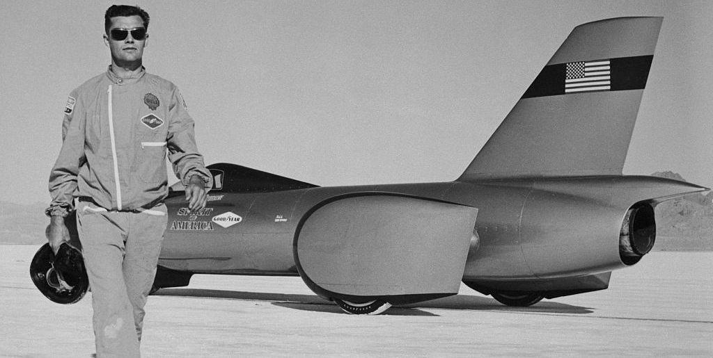 original caption craig breedlove, 26, of los angeles, driver and owner of the spirit of america walks away from his racer 731, after a successful trial run of 3495 mph