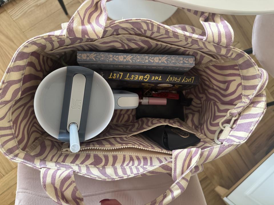 Stanley Quencher tumbler inside a packed tote bag