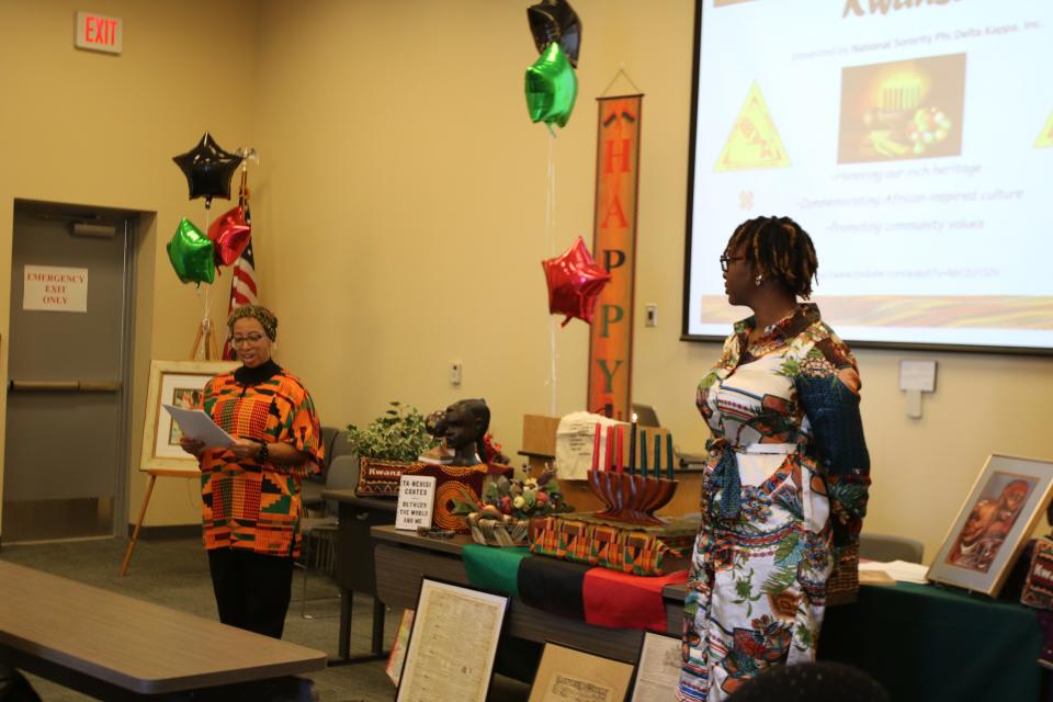 Shelley Clark of the Phi Delta Kappa Kwanzaa Committee led a Kwanzaa celebration program to provide educational facts about the holiday and its history.