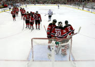 NEWARK, NJ - JUNE 09: The New Jersey Devils celebrate around Martin Brodeur #30 after defeating the Los Angeles Kings during Game Five of the 2012 NHL Stanley Cup Final at the Prudential Center on June 9, 2012 in Newark, New Jersey. (Photo by Elsa/Getty Images)