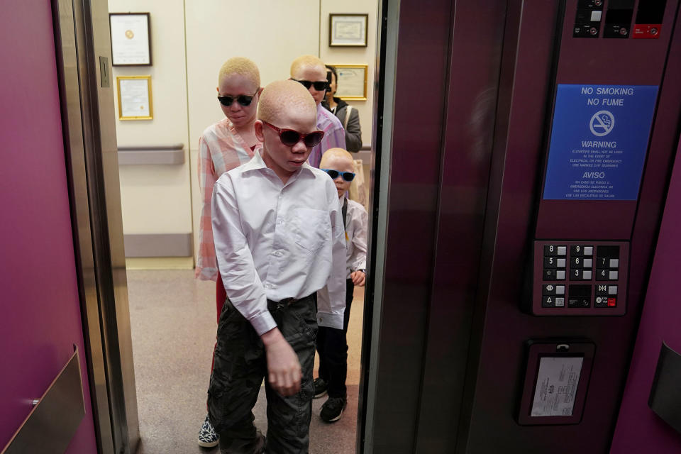 <p>Baraka Lusambo, 7, Mwigulu Magesaa 14, Emmanuel Rutema, 15, and Pendo Noni 16, Tanzanians with albinism who had body parts chopped off in witchcraft-driven attacks, arrive for prosthetic arm fittings at the Shriners Hospital in Philadelphia, Pa., on May 30, 2017. (Photo: Carlo Allegri/Reuters) </p>