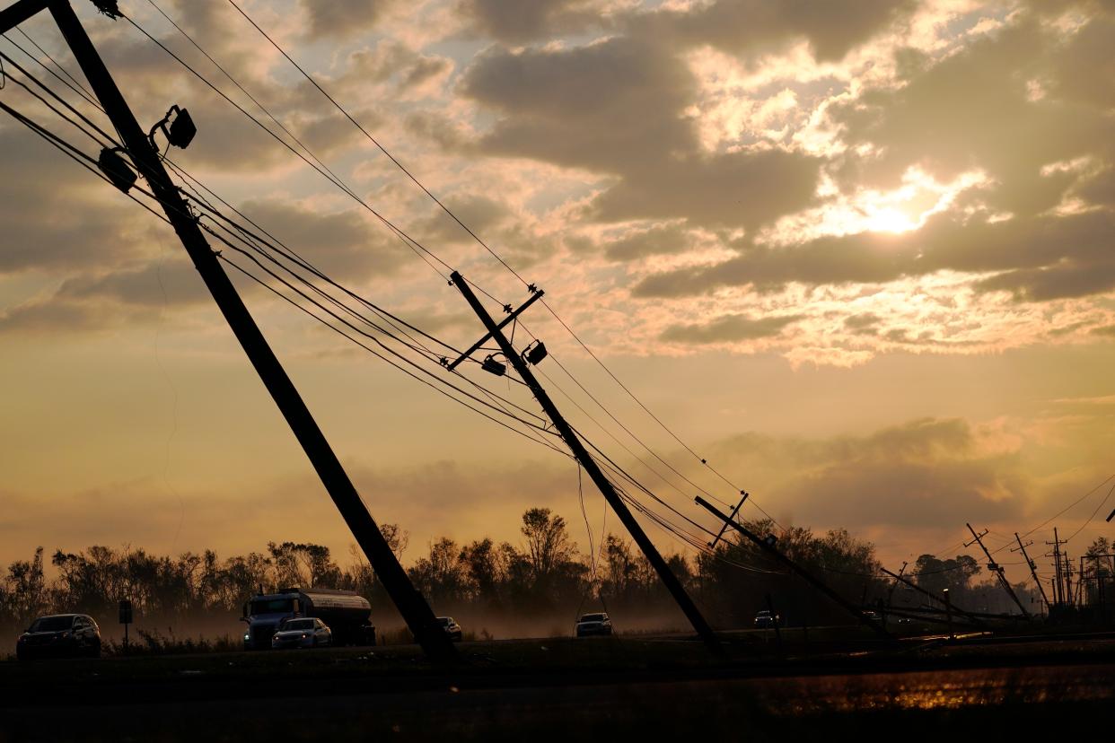 File: Downed power lines slump over a road in the aftermath of Hurricane Ida (AP)