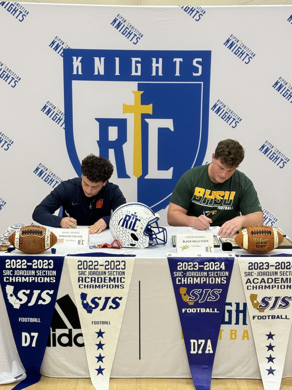 Ripon Christian's Carson Bunnell (right) and Brady Grondz (left) sign their letter of intent to play college football at Black Hills State University and Wheaton College.