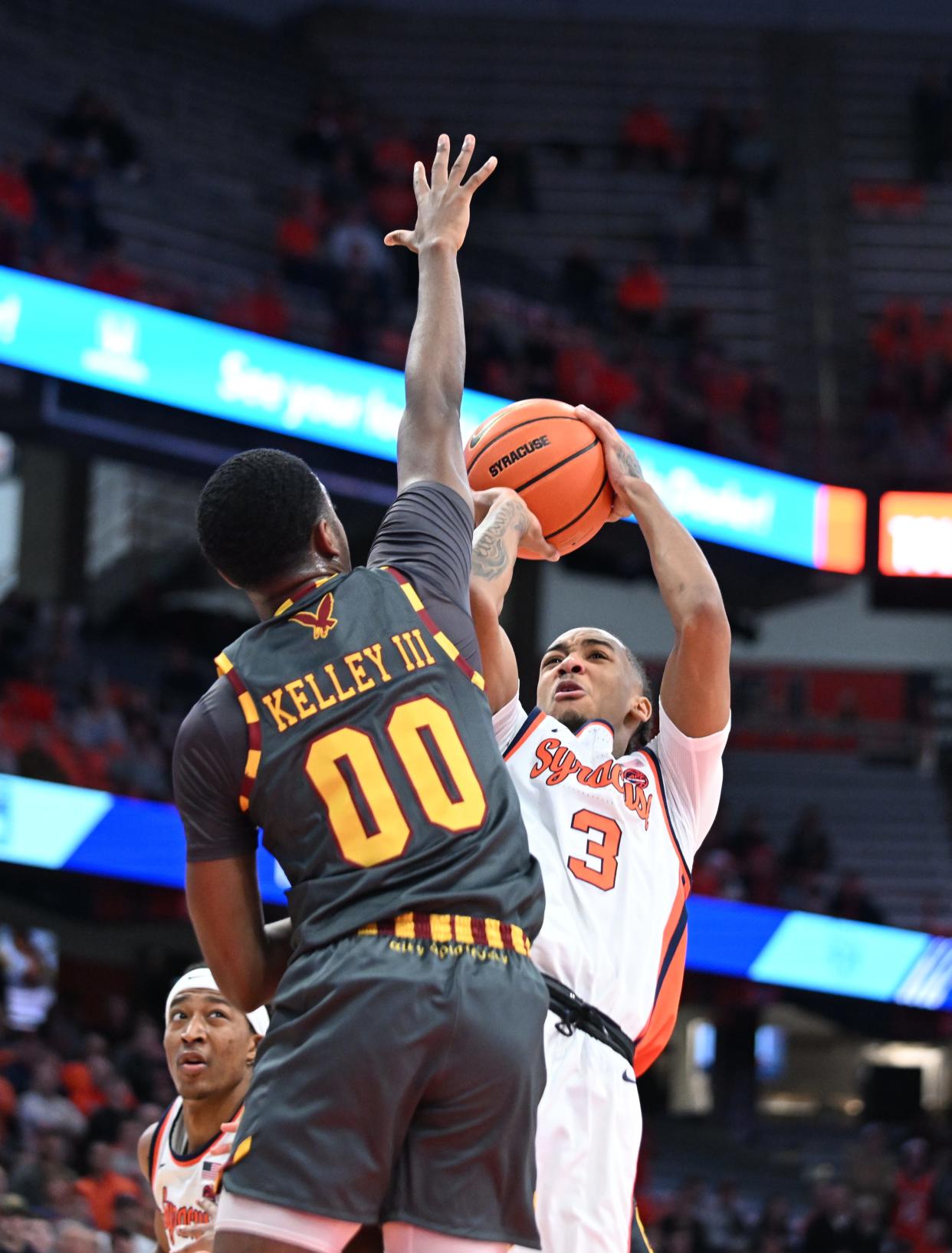 Syracuse Orange guard Judah Mintz (3) shoots the ball as Boston College Eagles guard Chas Kelley III (00) defends in the second half at the JMA Wireless Dome.