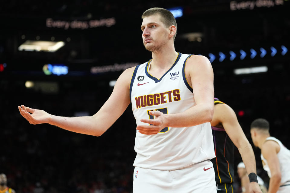 Denver Nuggets center Nikola Jokic (15) looks for a call during the first half of Game 6 of an NBA basketball Western Conference semifinal game against the Phoenix Suns, Thursday, May 11, 2023, in Phoenix. (AP Photo/Matt York)