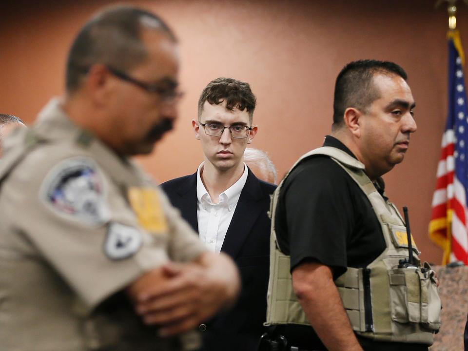 FILE - In the is Oct. 10, 2019 file photo, El Paso Walmart shooting suspect Patrick Crusius pleads not guilty during his arraignment in El Paso, Texas. The government has filed hate crime charges against Crusius, who said he was targeting Mexicans and shot to death 22 people at a Walmart store in El Paso, Texas, last summer, a person familiar with the matter told The Associated Press. (Briana Sanchez / El Paso Times via AP, Pool, File)