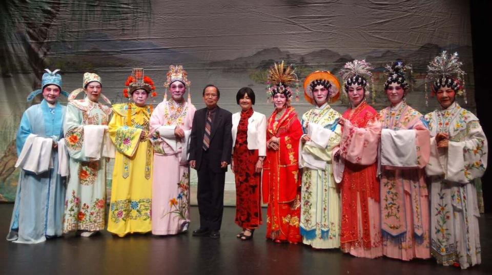 David Ling and his wife Jenny Lee, in middle, pose with members from the Regina Chinese Musical Association after a Chinese opera performance.