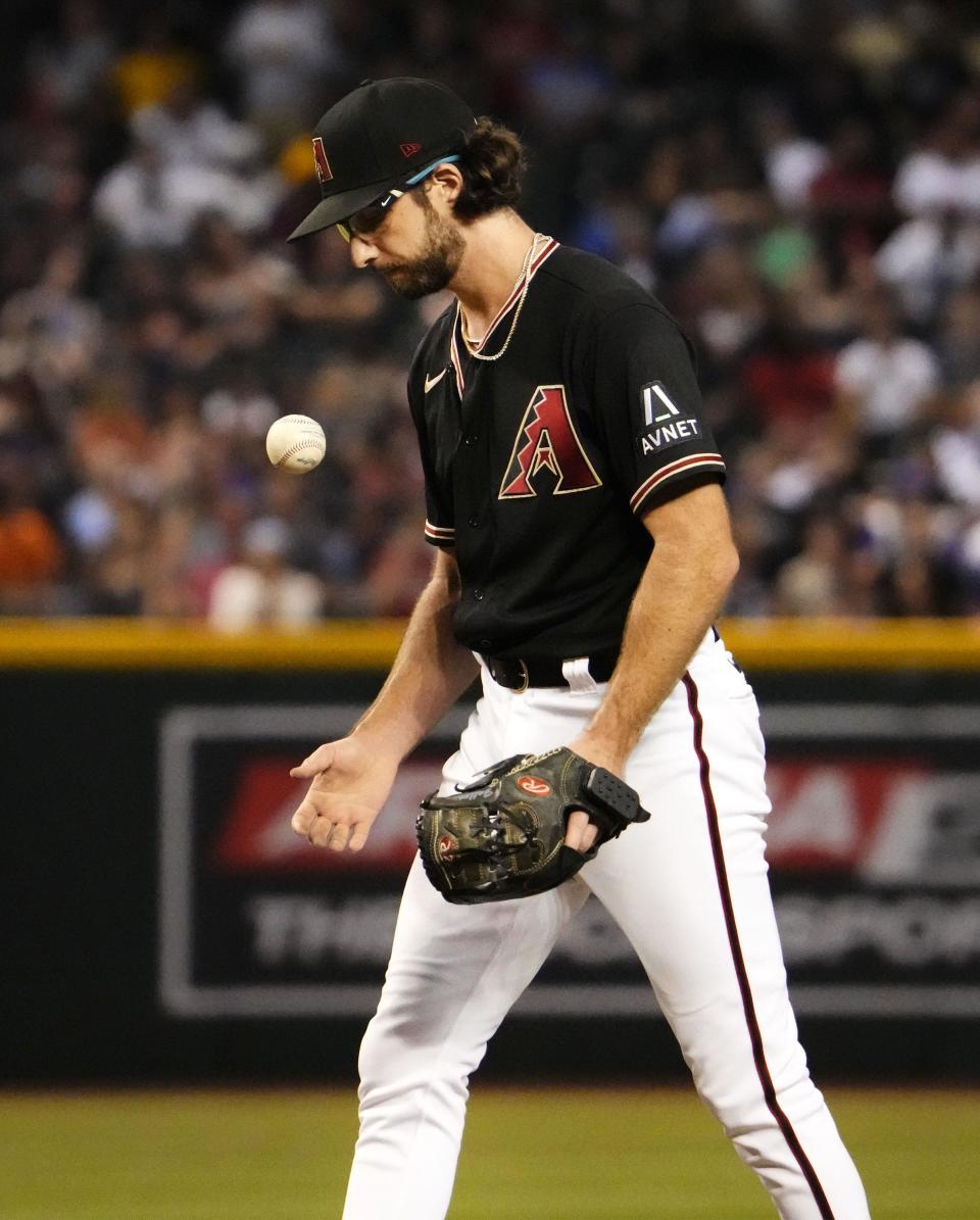 Arizona Diamondbacks starting pitcher Zac Gallen (23) reacts after a bases loaded walk against the San Francisco Giants in the fifth inning at Chase Field in Phoenix on Sept. 19, 2023.