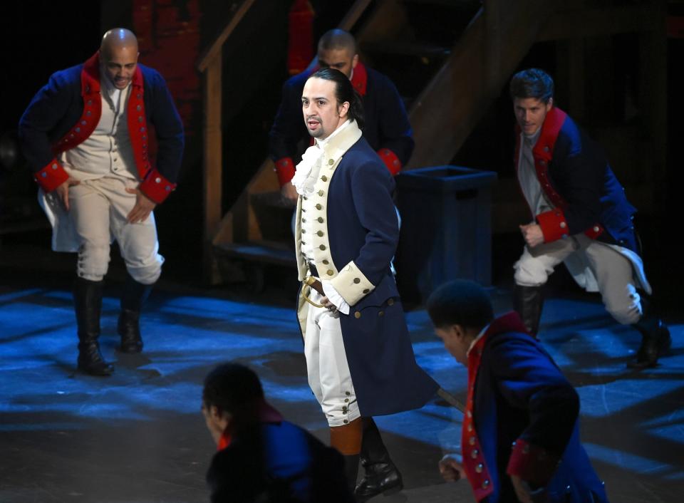 FILE - In this June 12, 2016 file photo, Lin-Manuel Miranda and the cast of "Hamilton" perform at the Tony Awards in New York. In the five decades since hip-hop emerged out of New York City, it has spread around the country and the world. And at each step there's been change and adaptation, as new, different voices came in and made it their own. Its foundations are steeped in the Black communities where it first made itself known but it's spread out until there’s no corner of the world that hasn’t been touched by it. Miranda’s groundbreaking musical about a distant white historical figure that came to life in the rhythms of its hip-hop soundtrack, brought a different energy and audience to the theater world. (Photo by Evan Agostini/Invision/AP, File)