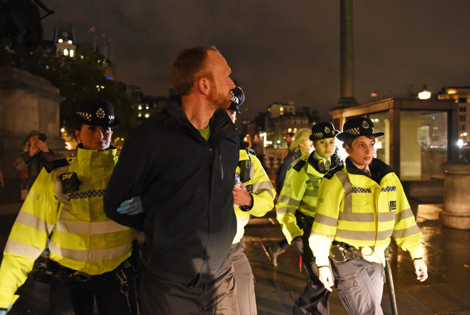 Police remove an Extinction Rebellion protester from Trafalgar Square in central London. (Photo by David Mirzoeff/PA Images via Getty Images)