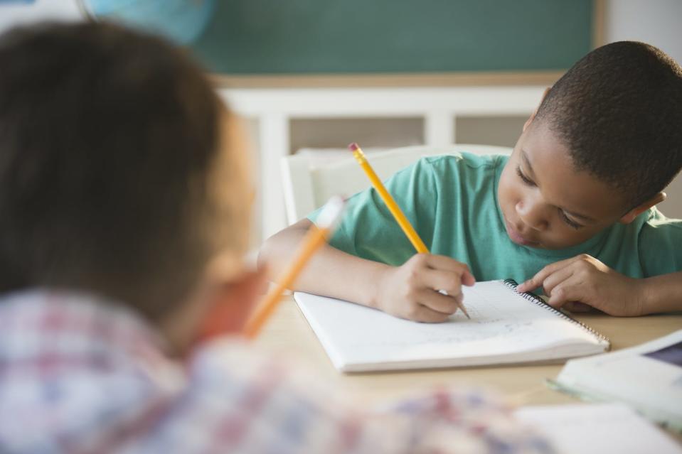 Gaps in educational performance persist along racial and socioeconomic lines. <a href="https://www.gettyimages.com/detail/photo/children-writing-in-classroom-royalty-free-image/158313145?phrase=american%20classroom&adppopup=true" rel="nofollow noopener" target="_blank" data-ylk="slk:Blend Images - JGI/Jamie Grill/Tetra Collection via Getty Images;elm:context_link;itc:0;sec:content-canvas" class="link ">Blend Images - JGI/Jamie Grill/Tetra Collection via Getty Images</a>