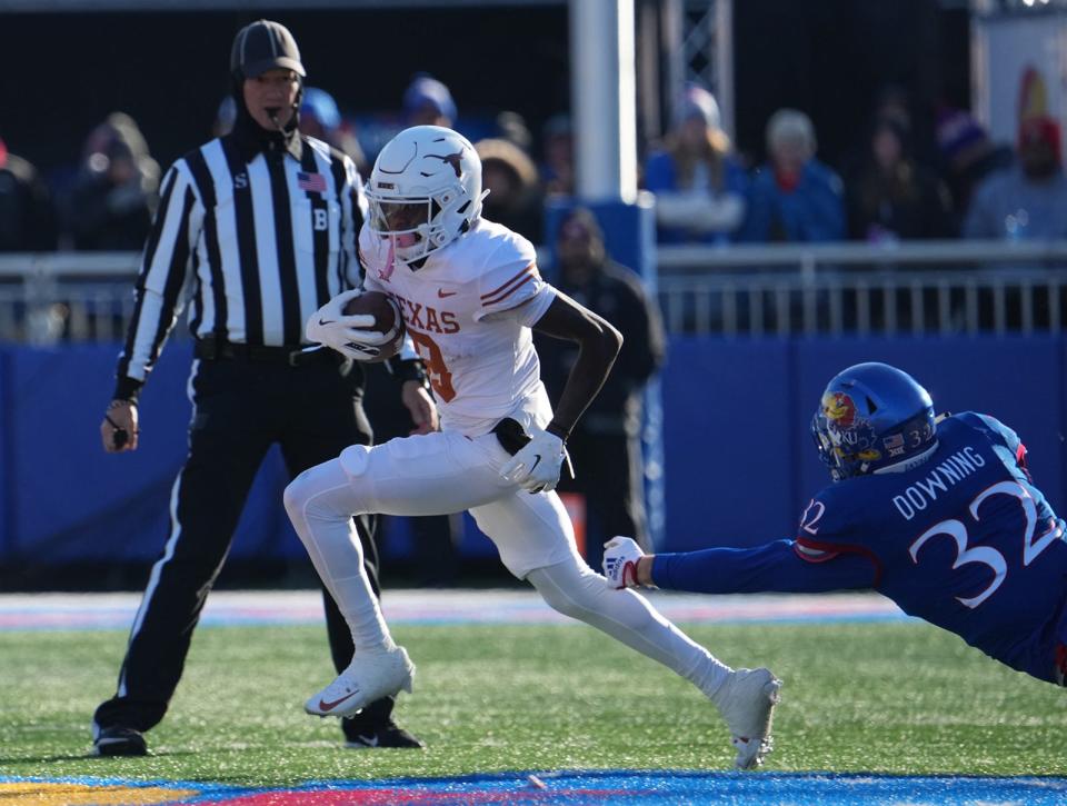 Texas Longhorns wide receiver Xavier Worthy (8) carries the ball during the Texas Longhorns football game against the Kansas Jayhawks in Lawrence, Kansas on Saturday, Nov. 19, 2022.<br>Ut Ku Football Mlc 00291