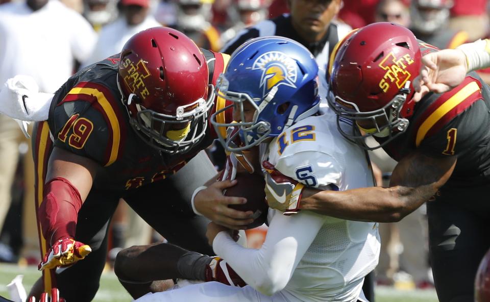 AMES, IA Ð SEPTEMBER 24: Quarterback Josh Love #12 of the San Jose State Spartans is sacked by defensive end JaQuan Bailey #19, and defensive back D’Andre Payne #1 of the Iowa State Cyclones. (Photo by David Purdy/Getty Images)