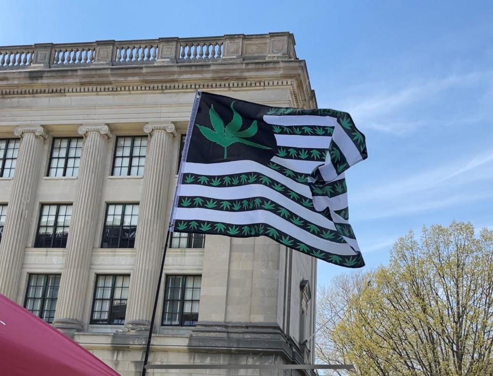 A flag emblazoned with a marijuana leaf flies at a 420 protest on April 20, 2021 in Trenton.