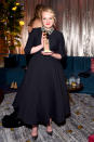 <p>Elisabeth Moss poses with her Golden Globe at the Fox, FX, and Hulu party. (Photo: Presley Ann/Getty Images) </p>