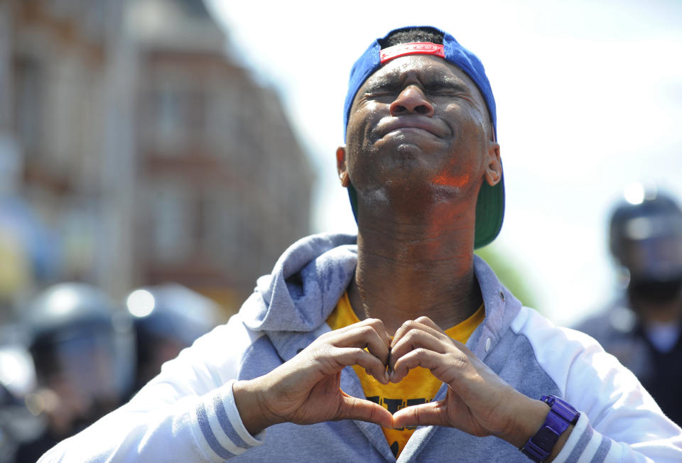 Devante Hill makes a heart with his hands after he was hit with pepper spray after someone threw a bottle at police on Tuesday, April 28, 2015, in Baltimore, MD, USA. Photo by Lloyd Fox/Baltimore Sun/TNS/ABACAPRESS.COM