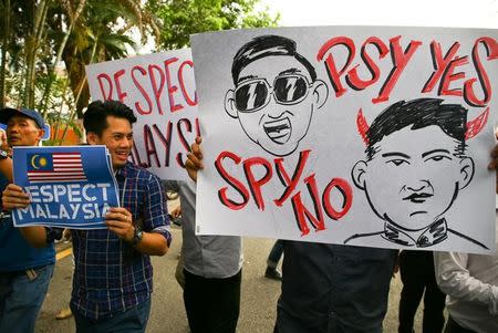 Members of the youth wing of the National Front, Malaysia's ruling coalition hold placards during a protest at the North Korea embassy, following the murder of Kim Jong Nam, in Kuala Lumpur, Malaysia, February 23, 2017. REUTERS/Athit Perawongmetha