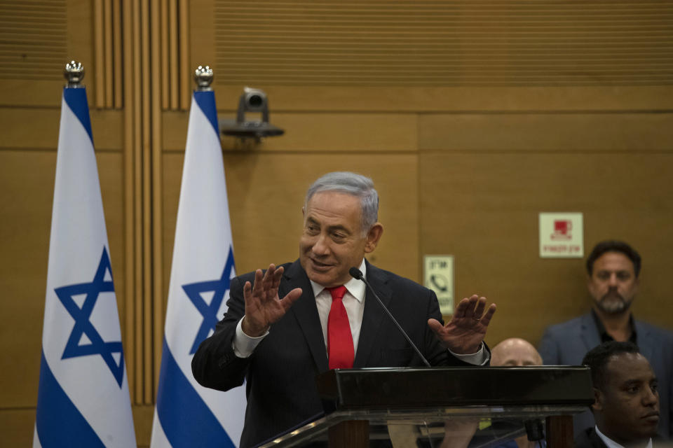 Former Israeli Prime Minister Benjamin Netanyahu speaks to right-wing opposition party members a day after a new government was sworn in, at the Knesset, Israel's parliament, in Jerusalem, Monday, June 14, 2021. (AP Photo/Maya Alleruzzo)