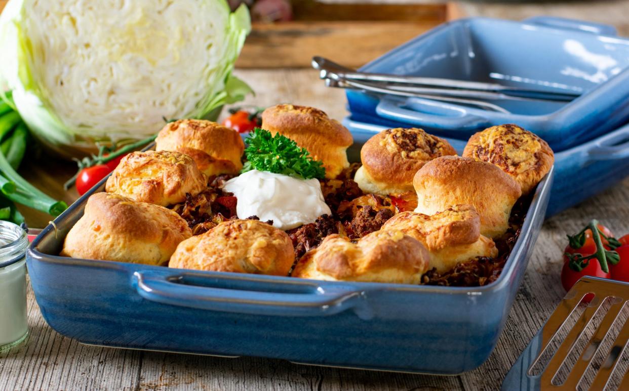 delicious family meal with a mince meat cabbage casserole and irish bread. Scones are baked with the casserole in the avoen. The meat ist a mix of pork and beef. Ready to eat dinner