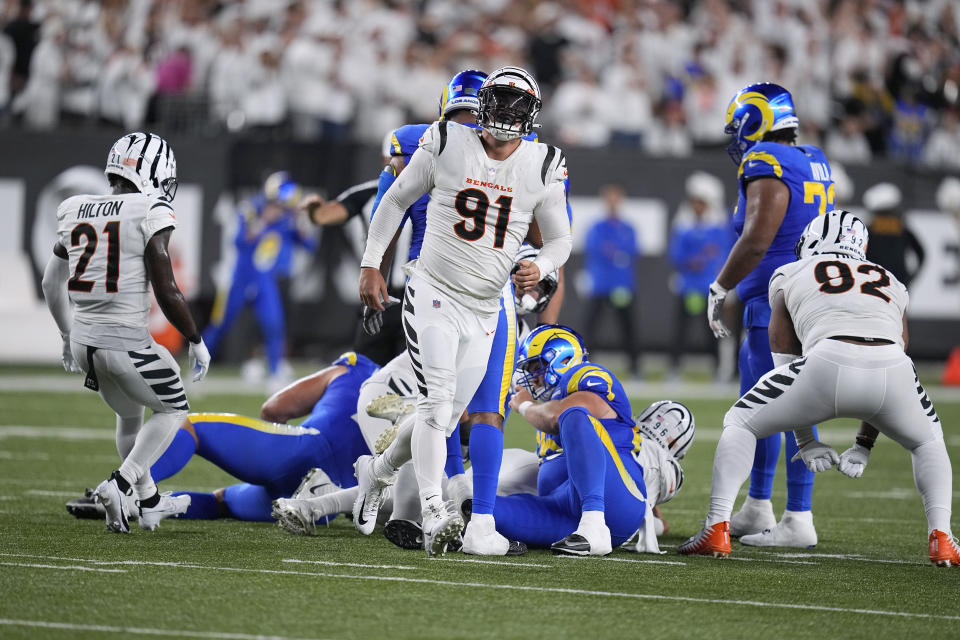 Cincinnati Bengals defensive end Trey Hendrickson (91) celebrates after sacking Los Angeles Rams quarterback Matthew Stafford during the second half of an NFL football game Monday, Sept. 25, 2023, in Cincinnati. (AP Photo/Darron Cummings)