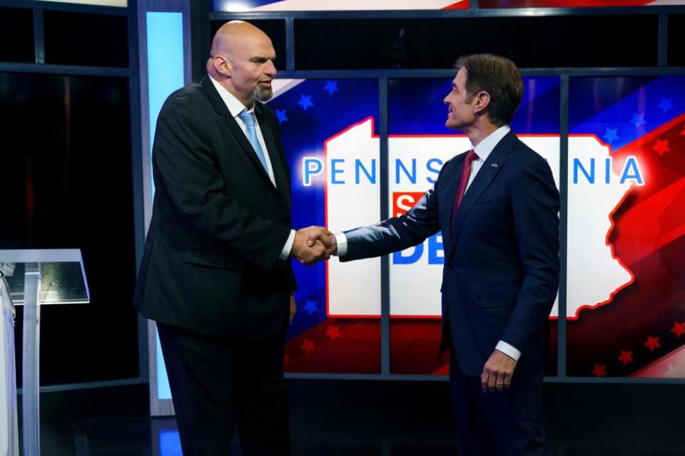 John Fetterman Mehmet Oz shake hands before the Pennsylvania Senate election debate on 25 October 2022.