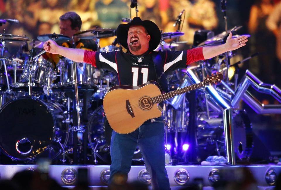 Country music legend Garth Brooks performs to over 75,000 fans, the largest indoor concert crowd ever in Arizona at State Farm Stadium on March 23, 2019 in Glendale, Ariz.