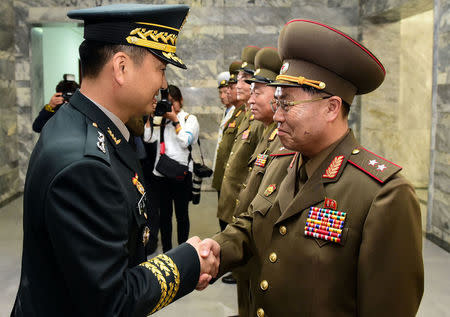 South Korean Major General Kim Do-gyun is greeted by North Korean Lieutenant General An Ik-san before their high-level miilitary talk at the northern side of the truce village of Panmunjom, in North Korea, June 14, 2018. Yonhap via REUTERS