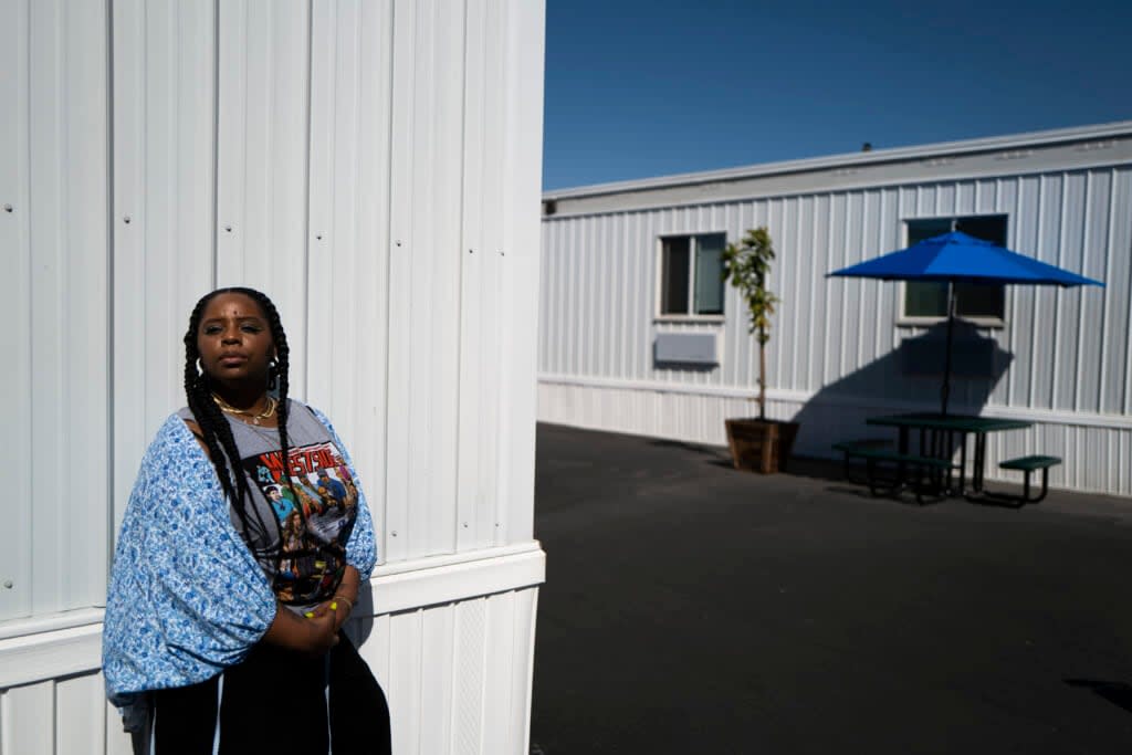 Black Lives Matter co-founder Patrisse Cullors stands for a photo while visiting the Hilda L. Solis Care First Village in Los Angeles, Tuesday, April 19, 2022. (AP Photo/Jae C. Hong)