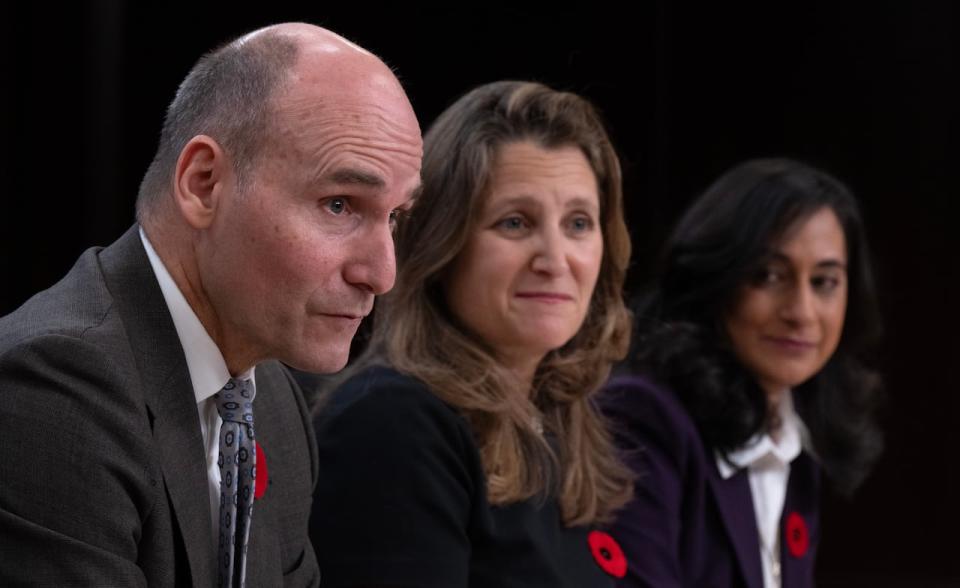 Deputy Prime Minister and Minister of Finance Chrystia Freeland and President of the Treasury Board Anita Anand look on as Public Services and Procurement Minister Jean-Yves Duclos speaks during a news conference, Tuesday, November 7, 2023 in Ottawa.