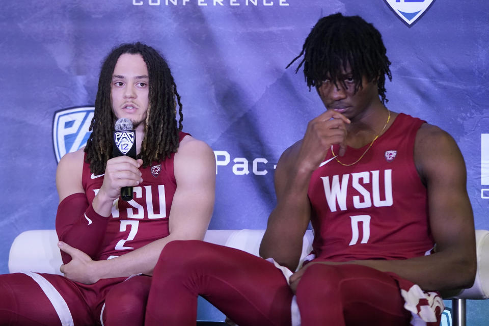 Washington State's Tyrell Roberts, left, speaks next to Efe Abogidi during Pac-12 Conference NCAA college basketball media day Wednesday, Oct. 13, 2021, in San Francisco. (AP Photo/Jeff Chiu)