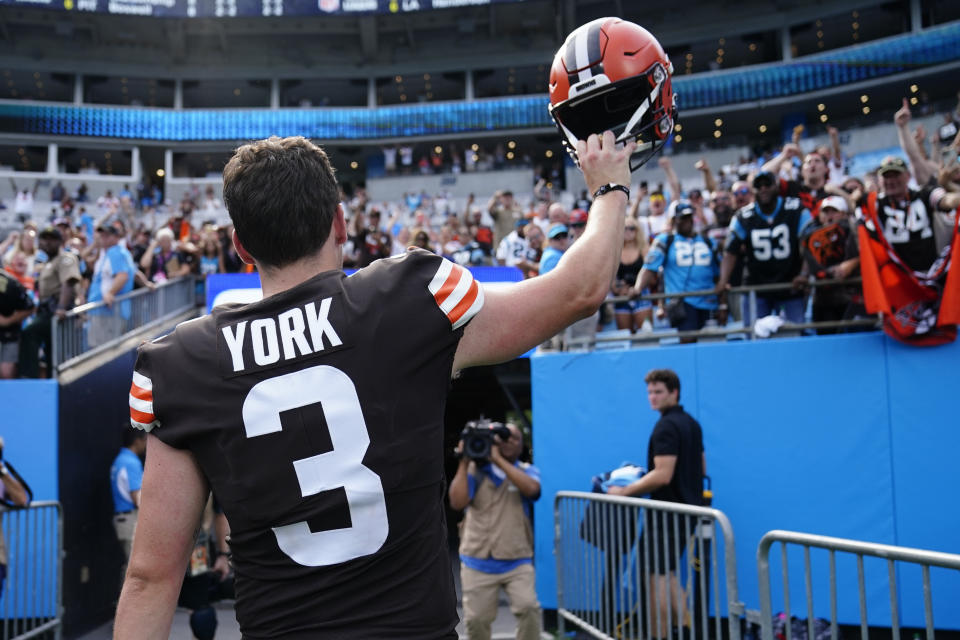 Cleveland Browns place kicker Cade York waves as he leaves the field after their win against the Carolina Panthers during an NFL football game on Sunday, Sept. 11, 2022, in Charlotte, N.C. York kicked the game winning field goal. (AP Photo/Jacob Kupferman)