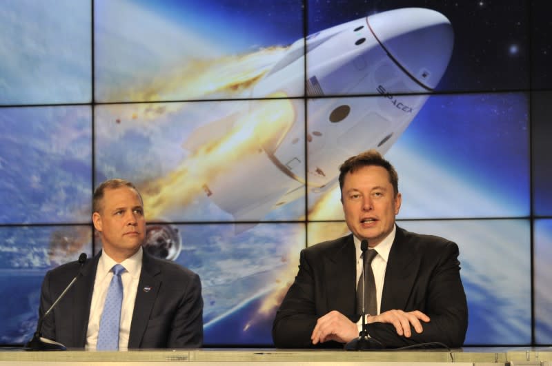 SpaceX founder and chief engineer Elon Musk speaks at a post-launch news conference to discuss the SpaceX Crew Dragon astronaut capsule in-flight abort test at the Kennedy Space Center