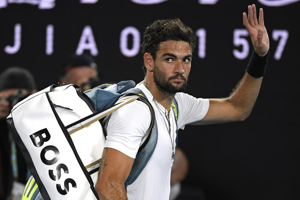 Matteo Berrettini of Italy waves as he leaves Rod Laver Arena after losing his semifinal to Rafael Nadal of Spain at the Australian Open tennis championships in Melbourne, Australia, Friday, Jan. 28, 2022.(AP Photo/Andy Brownbill)