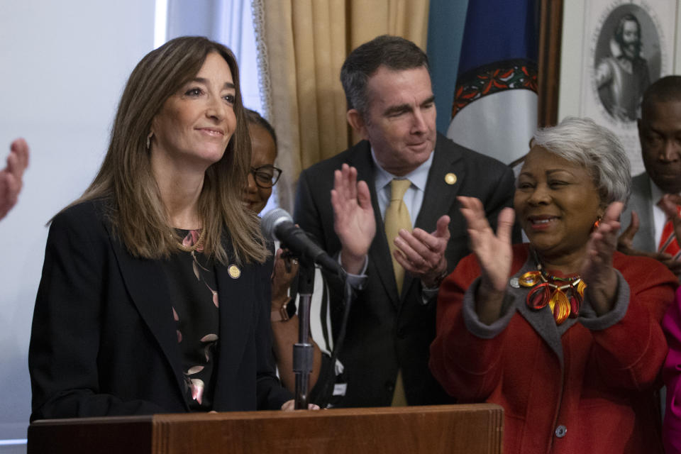 Virginia House of Delegates speaker-designate, Eileen Filler-Corn, left, and Virginia Gov. Ralph Northam, center, along with State Sen. Louise Lucas, D-Portsmouth, right, applaud during remarks on their legislative agenda at the Capitol in Richmond, Va., Tuesday, Jan. 7, 2020. (AP Photo/Steve Helber)