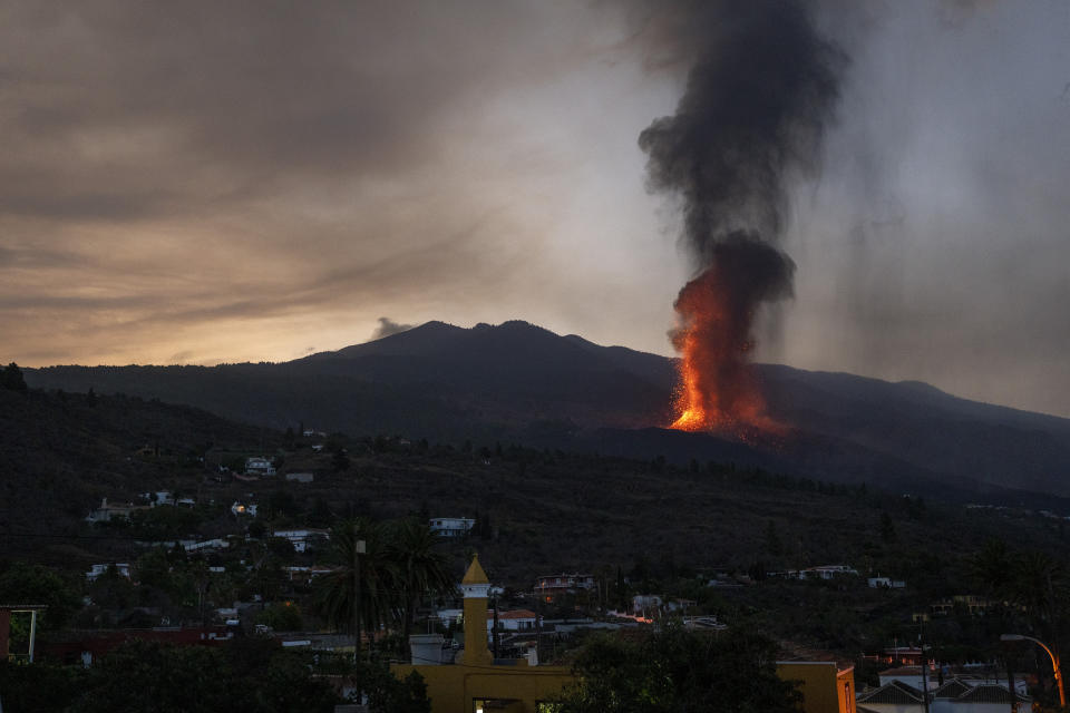 Lava flows in an eruption on the island of La Palma in the Canaries, Spain, Thursday, Sept. 23, 2021. A volcano on the small Spanish island in the Atlantic Ocean erupted on Sunday, forcing the evacuation of thousands of people. Experts say the eruption and its aftermath could last for up to 84 days. (AP Photo/Emilio Morenatti)