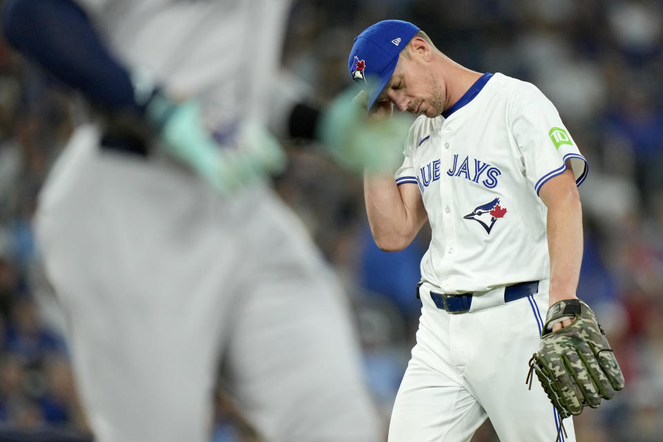 Toronto Blue Jays pitcher Chris Bassitt (40) reacts as New York Yankees' Aaron Judge (99) runs the bases during the first inning of a baseball game in Toronto, Saturday, June 29, 2024. (Frank Gunn/The Canadian Press via AP)