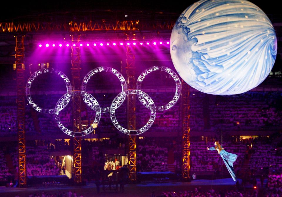 <p>During the Opening Ceremony, Turin showed off its culture and history with performers floating through the stadium with balloons. (AP) </p>