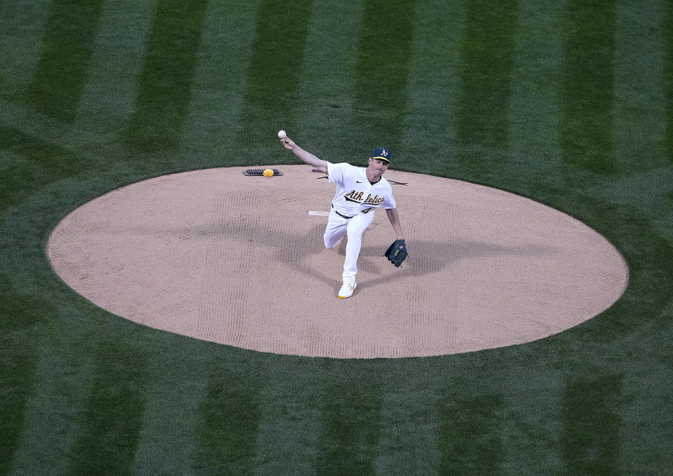 Oakland Athletics pitcher Chris Bassitt (40) works against the Houston Astros in the first inning of an opening day baseball game Oakland, Calif., Thursday, April 1, 2021. (AP Photo/Tony Avelar)