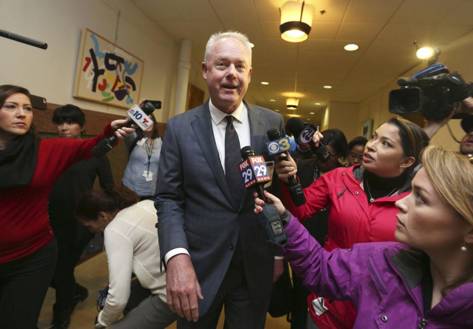 Starbucks CEO Kevin Johnson, center, walks toward a meeting with Philadelphia Mayor Jim Kenney and other officials at Philadelphia City Hall. Starbucks closed all its company-owned stores May 29, 2018, for an afternoon so store managers could get training on “unconscious bias.” AP Photo/JACQUELINE LARMA