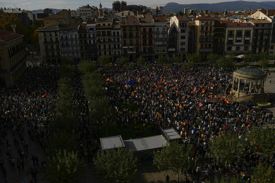 Crowds with Spanish flags pack Plaza del castillo square during a protest called by Spain's Conservative Popular Party in Pamplona, northern Spain, Sunday Nov.12, 2023. The Popular Party are protesting Spain's Socialists deal to grant amnesty to Catalan separatists in exchange for support of new government. (AP Photo/Alvaro Barrientos)