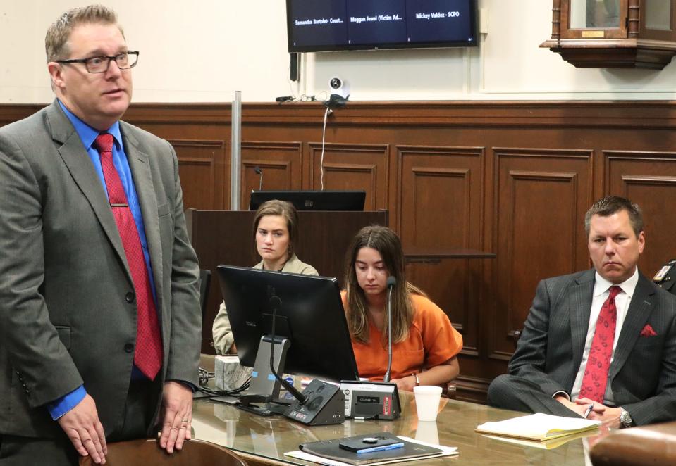 Assistant Summit County Prosecutor Brian Stano, left, addresses the court as Sydney Powell and her attorney Don Malarcik listen during her 2023 trial in Summit County Common Pleas Judge Kelly McLaughlin's courtroom.